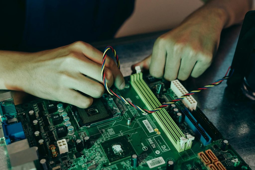 close up photo of person working on a motherboard